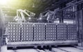 Robots manipulators stack bricks in a brick factory in a workshop