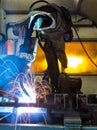 Robots welding in a car factory