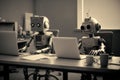 robots working in the office with laptops. future workforce, work automation concpet. generative AI