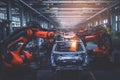 Robots in workshop of automobile plant. Automotive robotic factory. Welding Robot, assembly line production cars Manufacture. Royalty Free Stock Photo