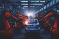 Robots in workshop of automobile plant. Automotive robotic factory. Welding Robot, assembly line production cars Manufacture Royalty Free Stock Photo