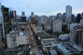 Robson street in Vancouver and the busy skyline.