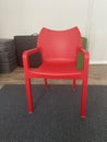 Robust Red Chair on the Gray Carpet