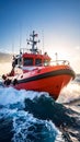 Robust red pilot vessel navigating through powerful ocean waves under a bright sky Royalty Free Stock Photo