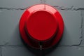 Industrial Grade Emergency Response Button Mounted on a Gray Brick Wall for Enhanced Safety and Security Systems Royalty Free Stock Photo
