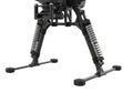 Robust tripod with extendable legs and shock-absorbing springs for camera support Royalty Free Stock Photo
