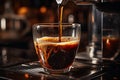 Robusta Pouring from Coffee Machine Flowing Into the Clear Small Glass in Cafe Royalty Free Stock Photo