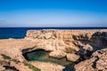 Overlooking the beautiful rock formations the Grotta della Poesia in the Puglia region of southern Italy