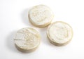 ROCAMADOUR, FRENCH GOAT CHEESE AGAINST WHITE BACKGROUND