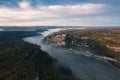 Rocamadour sunrise, Aerial view of the french village and castle on cliff in early morning with fogs in the Canyon of the Alzou