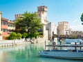 Rocca Scaligera, historical castle and old town on island, small harbor Royalty Free Stock Photo