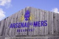 L`arsenal des mers brand logo and text sign harbor wooden building boat ancient