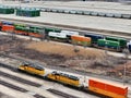 Union Pacific Railroad locomotives pulling a freight train with Global III freight yard in the background Royalty Free Stock Photo