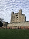 Rochester Castle surrounded by cumulus clouds in Kent, United Kingdom Royalty Free Stock Photo