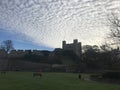 Rochester Castle surrounded by cumulus clouds in Kent, United Kingdom Royalty Free Stock Photo