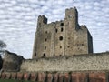 Rochester Castle surrounded by cumulus clouds in Kent, United Kingdom Royalty Free Stock Photo