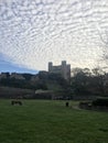 Rochester Castle surrounded by cumulus clouds in Kent, United Kingdom Royalty Free Stock Photo