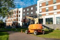 ROCHESTER, MN - 29 JUL 2020: JLG Boom Lift standing by a building