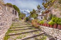 Rock alleyway staircase with gardens on Lesbos island Greece