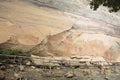 Rock art includes both humanoid and animal figures on cliffs at Pha Taem National Park in Ubon Ratchathani, Thailand