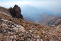 Rock on the background of the panorama of mountains of Tien Shan