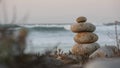 Rock balancing on pebble beach. Pyramid stacks of stones, ocean coast, sea water Royalty Free Stock Photo