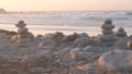 Rock balancing on pebble beach. Pyramid stacks of stones, ocean coast, sea water Royalty Free Stock Photo