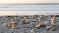 Rock balancing on pebble beach. Pyramid stacks of stones, ocean coast, sea water Royalty Free Stock Photo