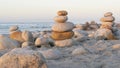 Rock balancing on pebble beach. Pyramid stacks of stones, ocean coast, sea water Royalty Free Stock Photo