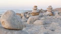 Rock balancing on pebble beach. Pyramid stacks of stones, ocean coast, sea water Royalty Free Stock Photo