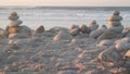 Rock balancing on pebble beach. Pyramid stacks of stones, ocean coast, sea water Royalty Free Stock Photo