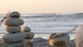 Rock balancing on pebble beach. Pyramid stacks of stones, ocean coast, sea water Royalty Free Stock Photo