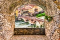 Rock balcony overlooking an ancient stone bridge in Verona, Ital