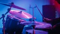 Rock Band Performing at a Concert in a Night Club. Close Up Portrait of a Drummer Playing the Drum Royalty Free Stock Photo