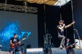 Rock band performs on a stage during outdoor free ethno-rock festival Kozak Fest