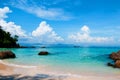 Rock Beach with crystal clear water and boat Phuket, Thailand Royalty Free Stock Photo