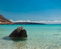 Rock at the beach in an island with crystal clear blue water in Mexico Royalty Free Stock Photo