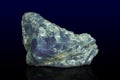 Rock of blue calcite mineral on dark background Royalty Free Stock Photo