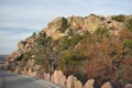 Rock bordered road leading up to Mt. Scott near Lawton Oklahoma. Royalty Free Stock Photo