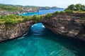 Rock broken by an ocean wave forming an arch in the mountain. Cliff is washed by powerful waves of ocean Royalty Free Stock Photo