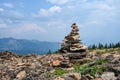 Rock cairn on a mountain peak built out of broken pieces of dacite rock weathered by time and exposure to the elements