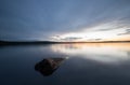 Rock in a calm lake in sweden