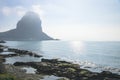 The rock of Calpe `Ifach` during foggy morning along beach, Calpe, Spain Royalty Free Stock Photo