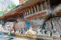 Rock carving of Sakyamuni Buddha entering Nirvana, with his disciples Royalty Free Stock Photo