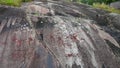 Granite bedrock Aspeberget in Tanumshede with rock paintings in Sweden Royalty Free Stock Photo
