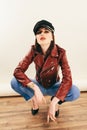 Rock chick in leather jacket, full length. Fashion portrait of elegant woman, studio shot Royalty Free Stock Photo