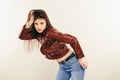 Rock chick in leather jacket, full length. Fashion portrait of elegant woman, studio shot