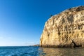 Rock and cliff coast under a brigh blue sky with sea caves on the Atlantic coast