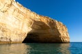 Rock and cliff coast under a brigh blue sky with sea caves on the Atlantic coast