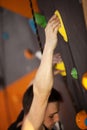 Rock climber on artificial climbing wall Royalty Free Stock Photo